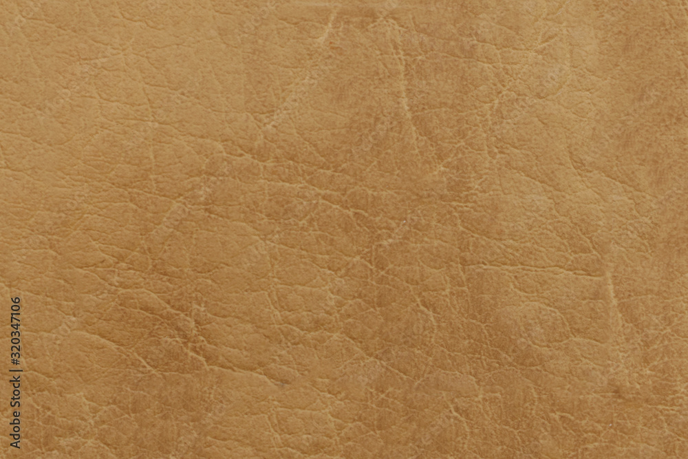 Brown genuine leather. Textured surface with a pattern. Brown genuine leather. Textured surface with a pattern.