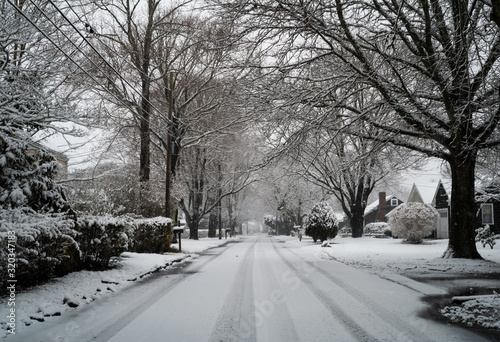 Snow Falls Over a New England Neighborhood in Winter