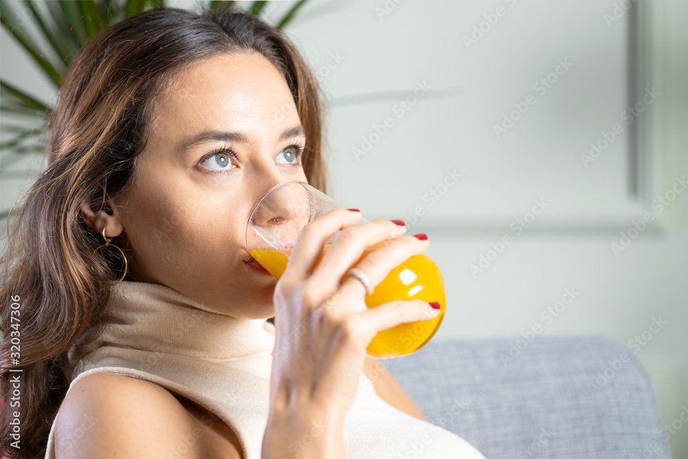 Young woman drinking orange juice Young woman drinking orange juice