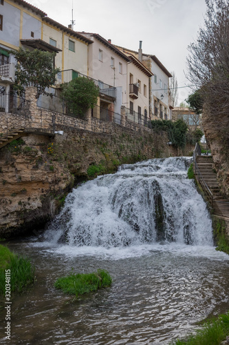 Cifuentes river waterfall when it passes through the center of Trillo, Guadalajara, Spain © LourdesConvertida