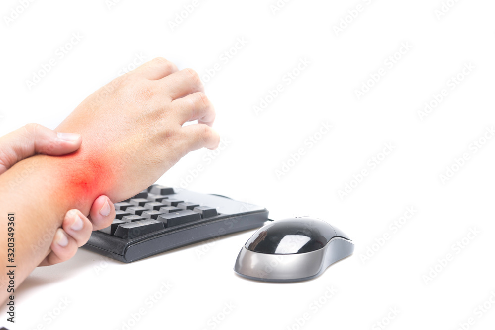 Wrist pain with redness and swelling while working with computer. Selective focus on the wrist pain. Wrist pain with redness and swelling while working with computer. Selective focus on the wrist pain.