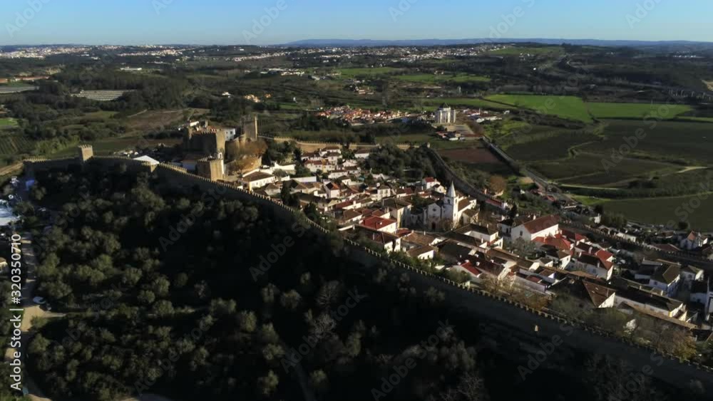 Zoom out aerial of castle walled town of Obidos, Portugal. Zoom out aerial of castle walled town of Obidos, Portugal.