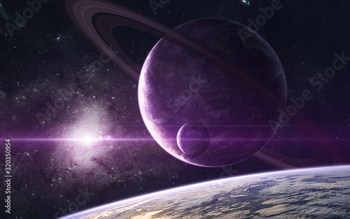 Planets in bright purple light of center of spiral galaxy. Star clusters in deep space. Science fiction. Elements of this image furnished by NASA