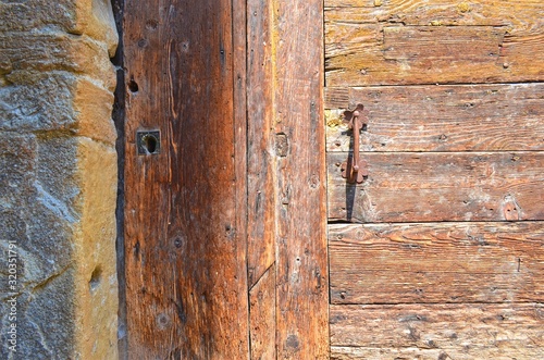 Wallpaper Mural part of old wooden doors with rough surface and metal handle Torontodigital.ca