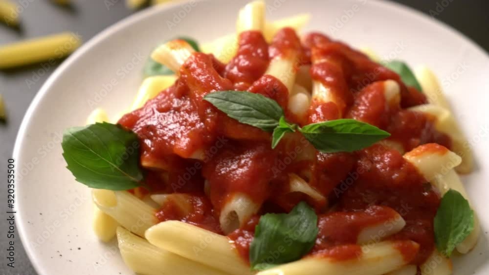 Penne pasta in tomato sauce - Italian food style Penne pasta in tomato sauce - Italian food style