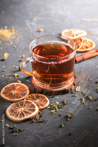A Cup of freshly brewed black tea on dark background