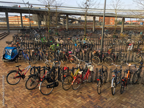 Bicycles in a parking lot in Copenhagen near one of the metro stations. And Copenhagen is sometimes called the bicycle capital of Europe. 2019 Odense. Denmark