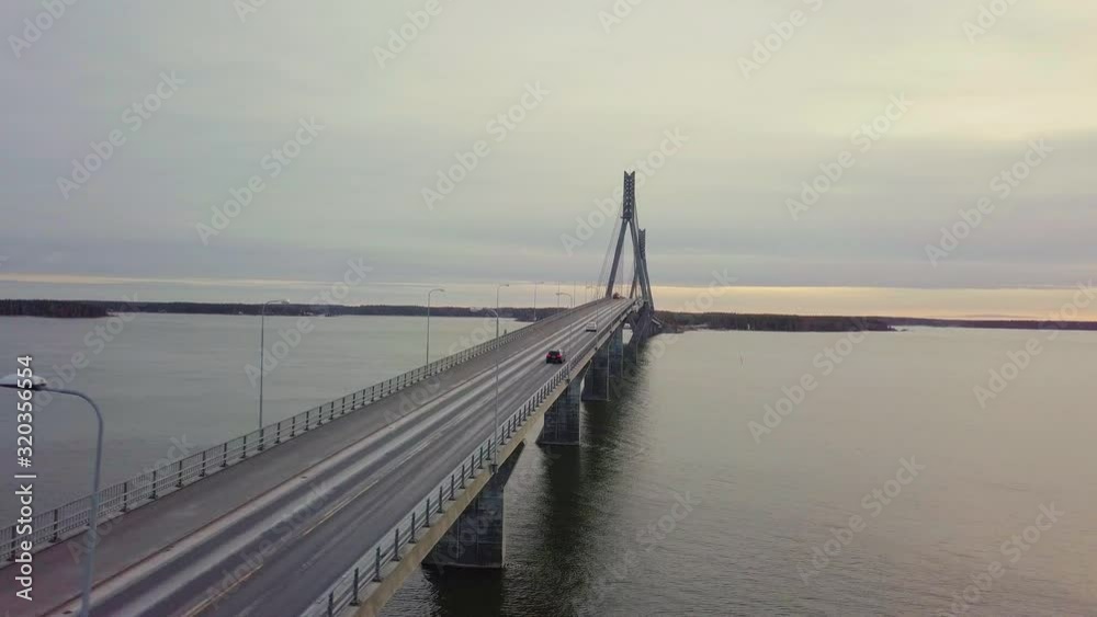 Aerial directly above traffic on two lane road on Replot Bridge in Finland Aerial directly above traffic on two lane road on Replot Bridge in Finland