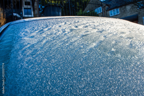 Ice crystals from frost appearing as "fur" or "grass" on a car windscreen on a cold winter morning
