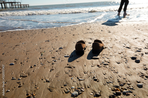 shoes on the sand beach © kartheas