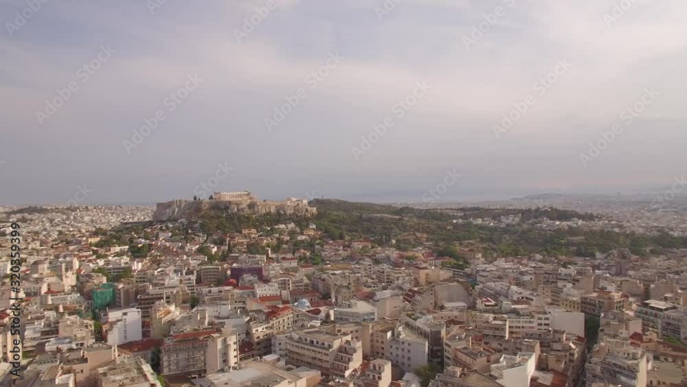aerial drone shots panning above urban Athens capital of Greece and reveals historical monument of Parthenon Acropolis sunny day establishment shot aerial drone shots panning above urban Athens capital of Greece and reveals historical monument of Parthenon Acropolis sunny day establishment shot