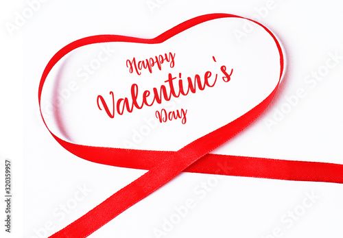 Happy valentine's day red heart ribbon in white background.