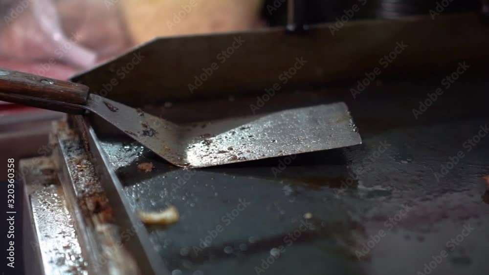 Dirty kitchen after frying food. Handheld pan left, shallow focus Dirty kitchen after frying food. Handheld pan left, shallow focus