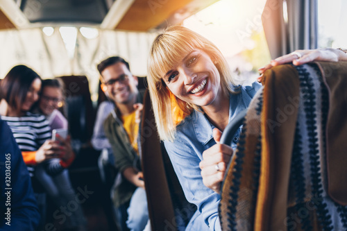 Happy passengers traveling by bus.