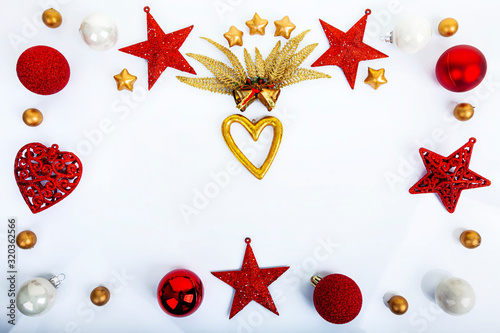 Obraz na płótnie Christmas decorations, balls, stars, bells, gold heart and gold leafs. w salonie