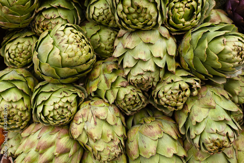 Fototapeta premium Background of fresh artichokes