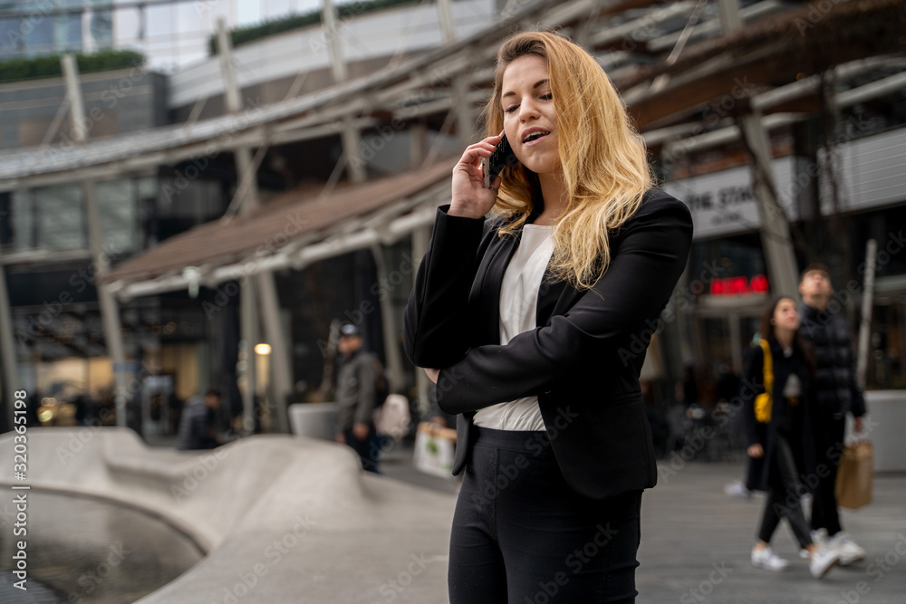 Fototapeta premium Happy Blonde Business Woman Talking On The Phone