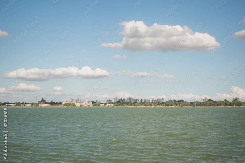 View of a lake, under the sky with clouds