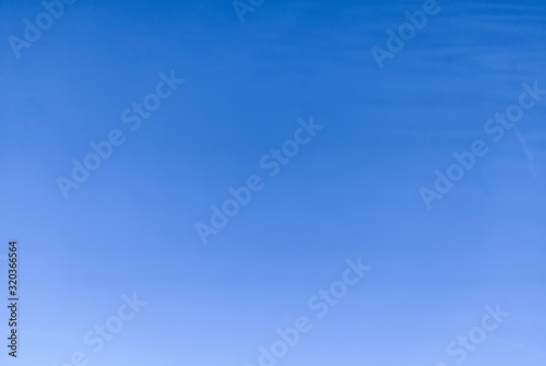 Clear cloudless - slightly cloudy - blue sky on the sunny day