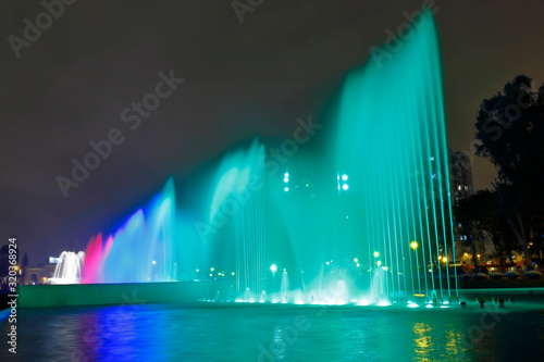 Beautiful view of a colorful water fountain, inside the magical water circuit in Lima, one of the largest existing water theme parks. Lima Peru