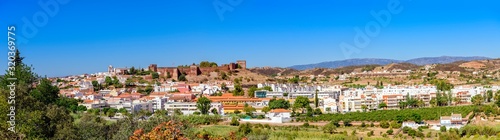 09.27.2019. Silves, Algarve, Portugal. Distant panoramic view of Silves in East Algarve showing the hilltop fort and church.