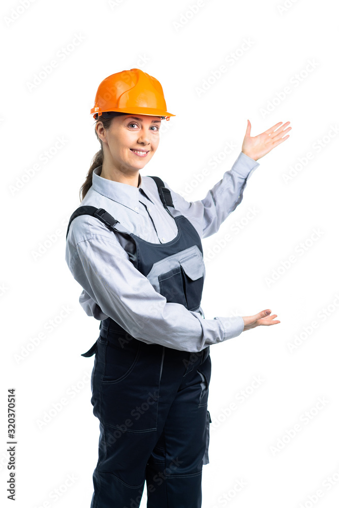 Woman builder shows hand gestures to the side. Isolated Woman builder shows hand gestures to the side. Isolated