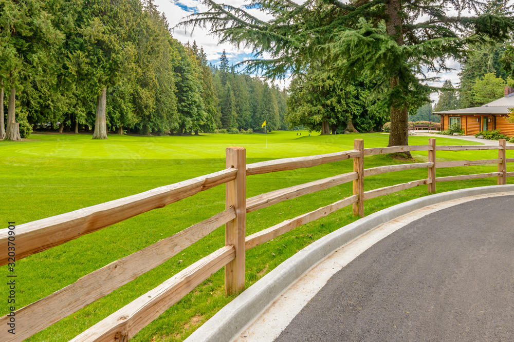 Golf course with wooden fence