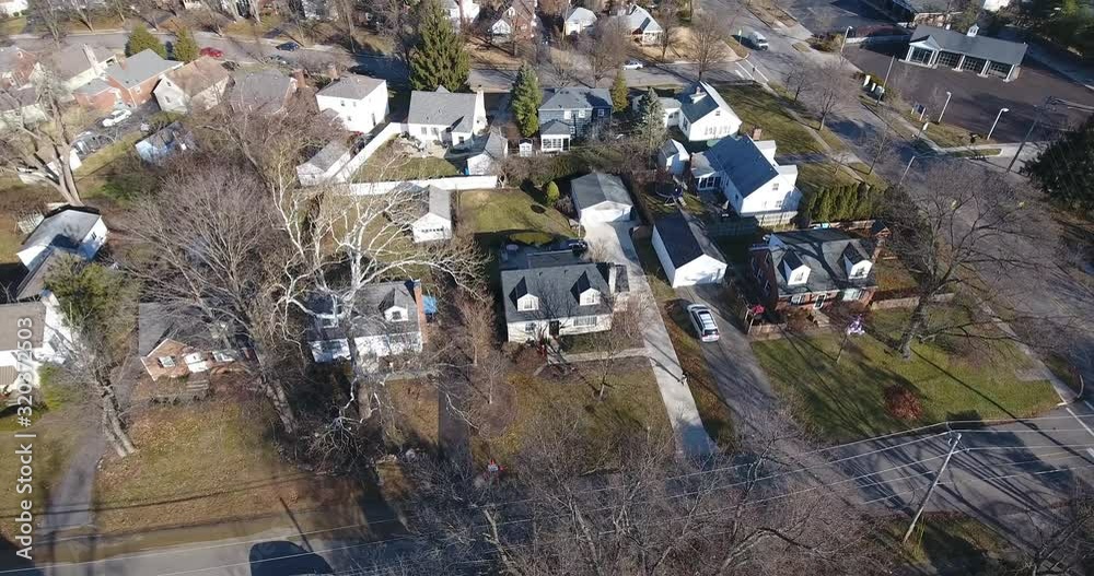 A slowly orbiting aerial view of a typical Ohio residential neighborhood. A slowly orbiting aerial view of a typical Ohio residential neighborhood.
