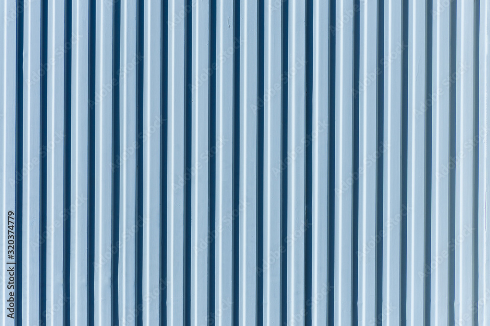 blue metal door with vertical stripes