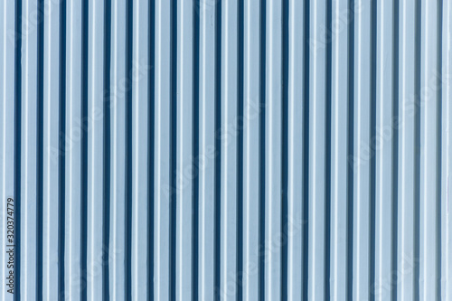 blue metal door with vertical stripes