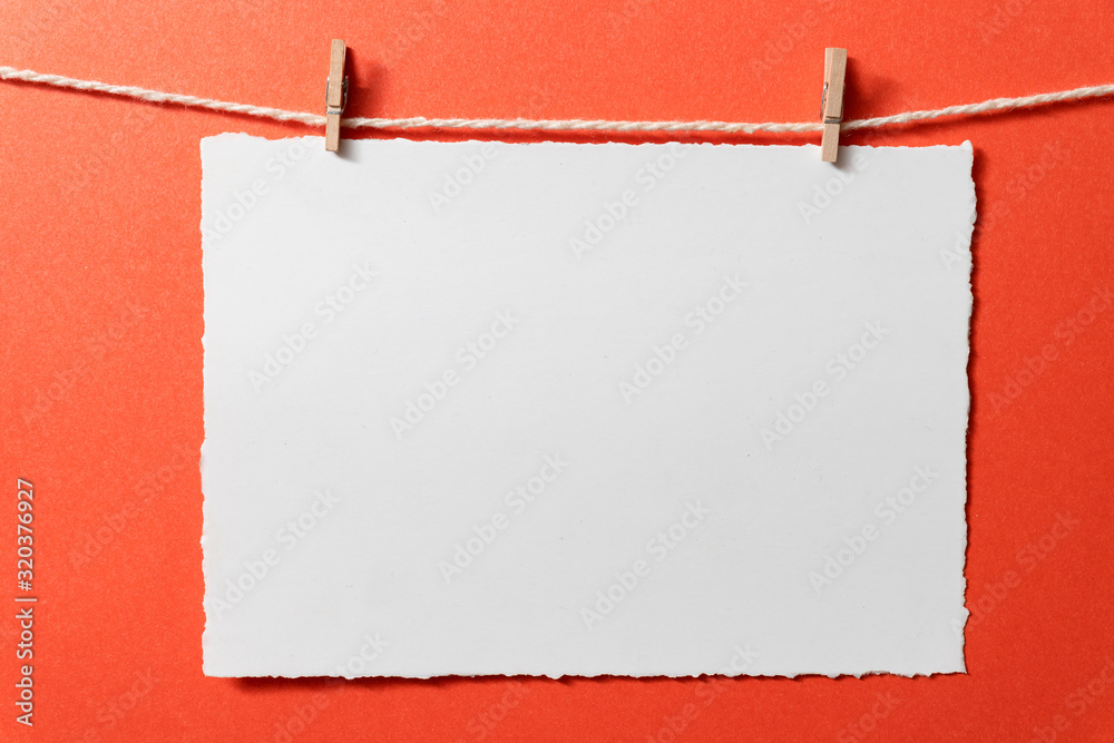 Template empty postcards with tiny clothespins on a red background. Stock  Photo
