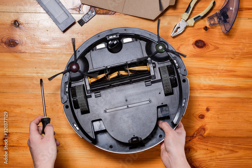 Maintenance and service of a robot vacuum cleaner. Cleaning, repair, replacement of parts