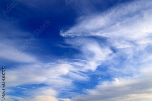 Beautiful picturesque unusual white feather clouds in the blue sky, magic background. fantastic white clouds. Landscape background, climate change, global warming © rospoint