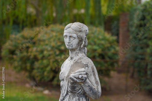 Statue of woman in a garden © Soledad