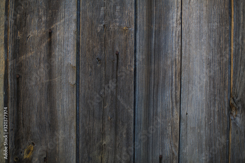 Old wooden door made of wooden boards with nails, retro wood texture
