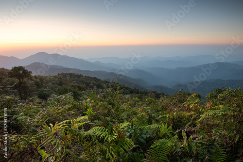 Sunset over the mountains view from San Dan peak, Natural summer landscape, Khlong Naka Wildlife Sanctuary, Ranong, Thailand