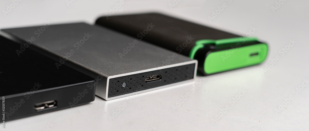 three external hdd drives one the shelf, data backup storage three external hdd drives one the shelf, data backup storage