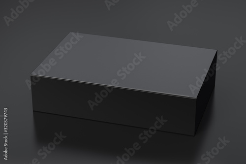Blank black wide flat box with closed hinged flap lid on black background. Clipping path around box mock up. 3d illustration