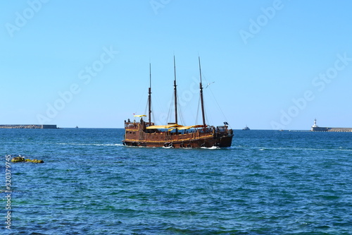 wooden schooner floating on the sea