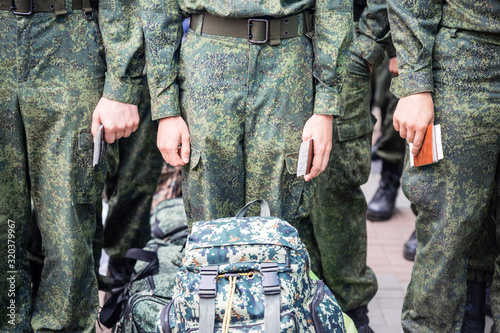cadets in uniform stand in formation