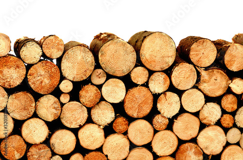 Firewood stacked and prepared for winter - pile of wood logs isolated on white background.
