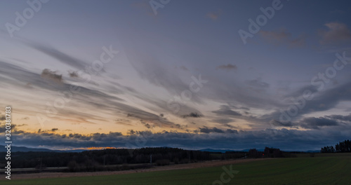 Color sunrise on green field near Vyhen village in south Bohemia © luzkovyvagon.cz