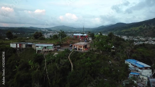 Cayey City, Puerto Rico. Aerial View of Suburban Neighborhood and Tropical Vegetation photo