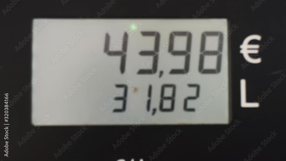 Closeup Of Price Gauge While Pumping Gas Fuel For Car.
Closeup Of Price Gauge While Pumping Gas Fuel For Car.