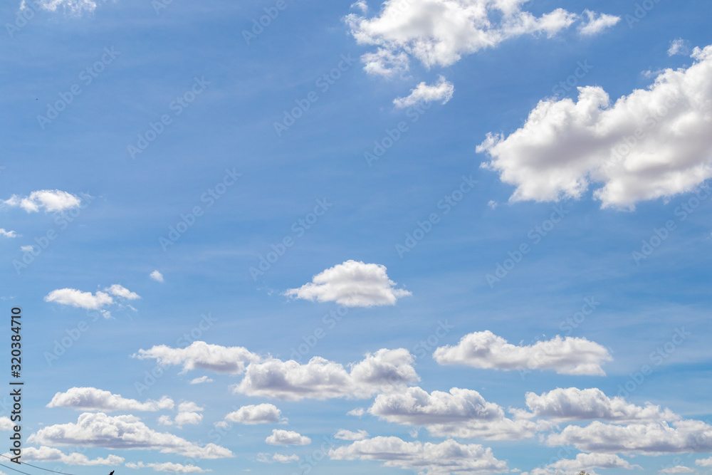 Fluffy clouds and blue sky on a clear day Fluffy clouds and blue sky on a clear day