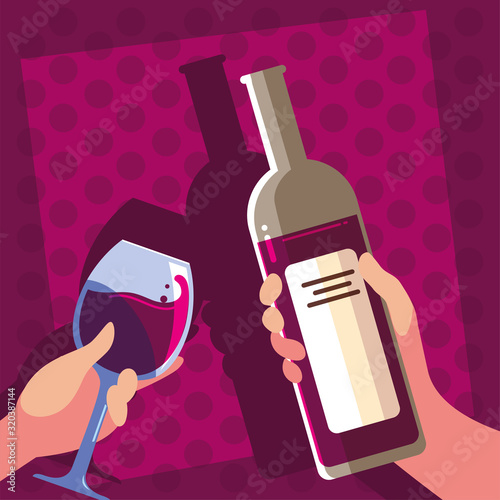 hands holding a bottle and glass of wine