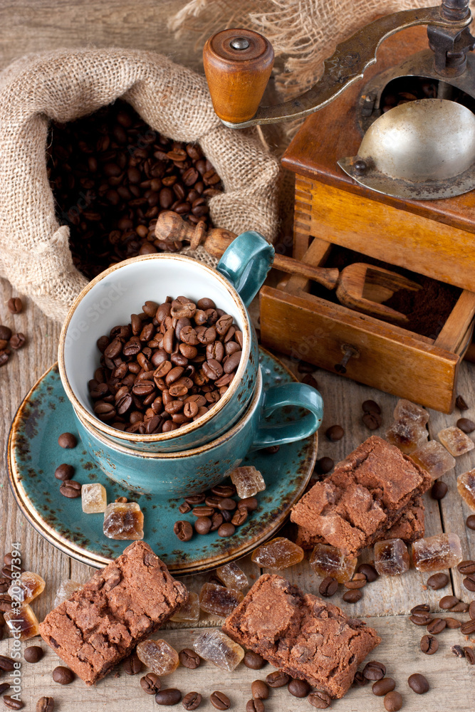 Fresh coffee bean in coffee bean grinder on wooden background Fresh coffee bean in coffee bean grinder on wooden background