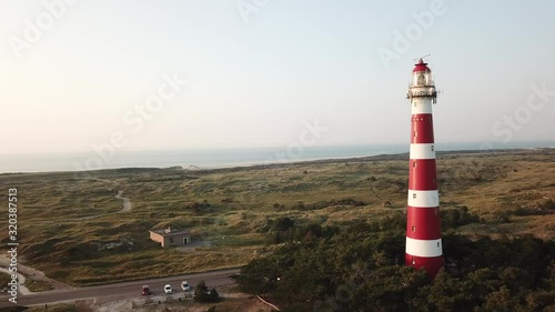 On the waddenisland called Ameland in The Netherlands. Drone shots of the Lighthouse of Ameland on an island. photo