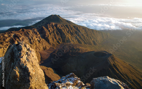 Mount Meru and its ash cone above clouds. Arusha  Tanzania. Africa.  photo
