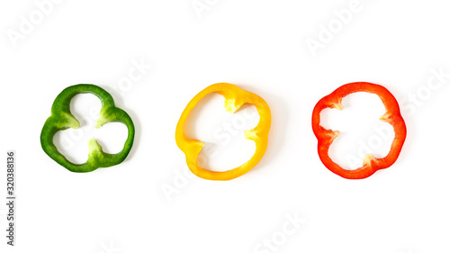 Fotografie, Tablou Set of colorful sliced bell pepper isolated on white background top view